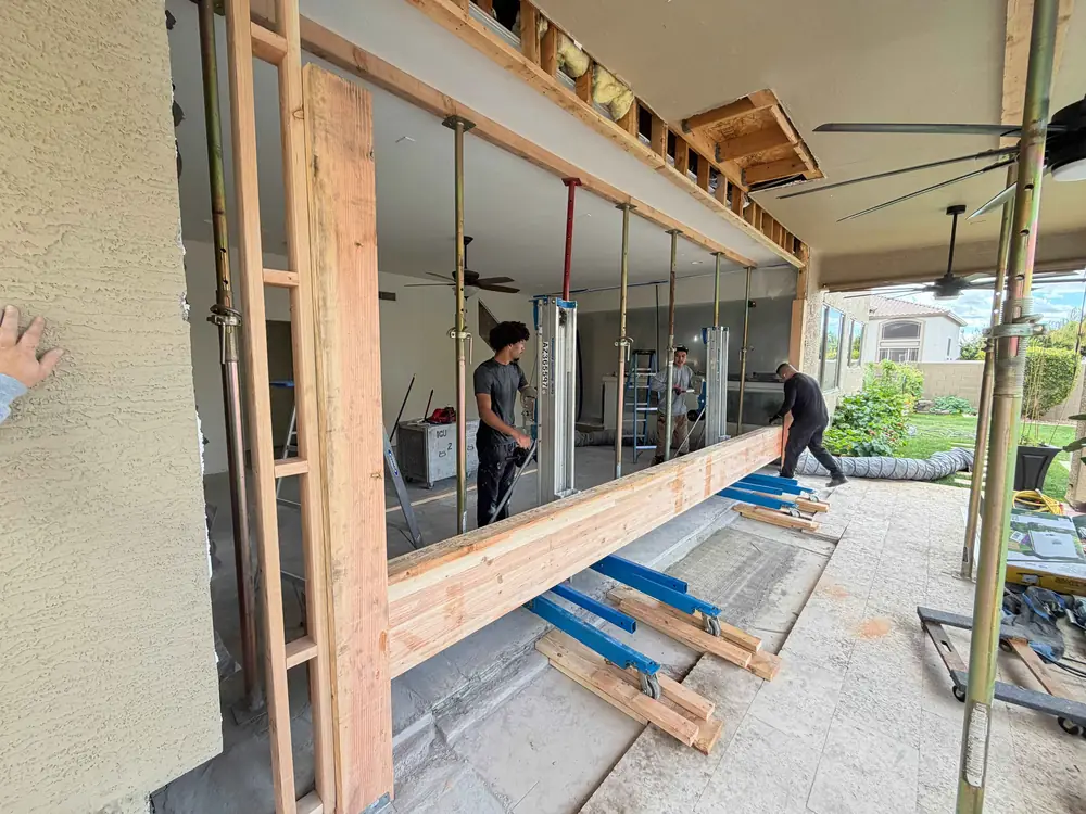 Restored crew shoring and framing a large structural opening on a job site
