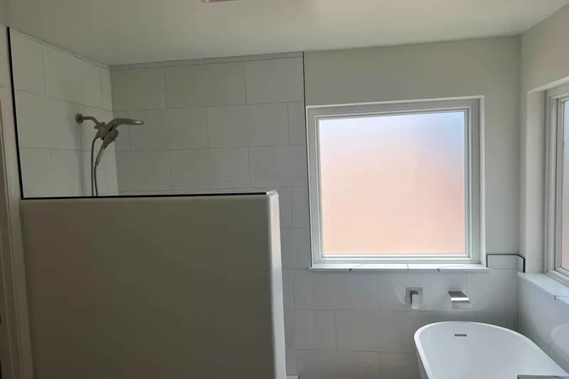 Bathroom with a walk-in shower alongside a soaking tub