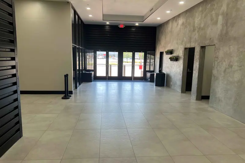 Finished commercial entry with glazed doors and large format floor tile