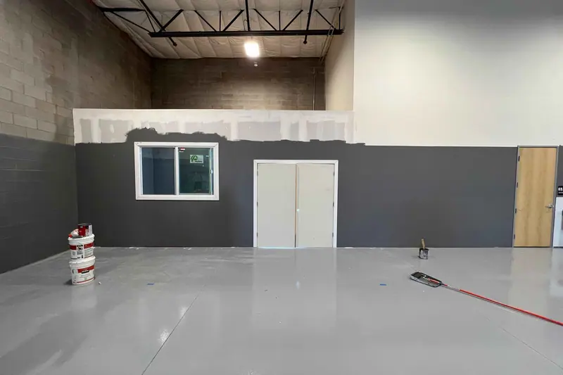 Commercial space with a new epoxy floor and painted block walls