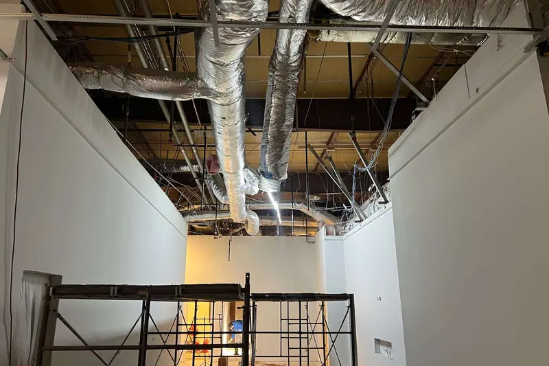 Ceiling opened to expose ductwork during a commercial reconstruction
