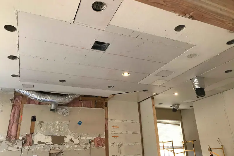 Suspended ceiling opened up over a room being rebuilt