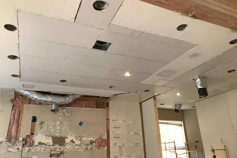 A ceiling opened up after water came through from above